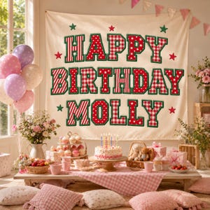 May include: A cream-colored fabric wall hanging featuring the text HAPPY BIRTHDAY MOLLY in large, block-style letters. The letters are decorated with red and white gingham, polka dot, and striped patterns, accented by small green and red stars.