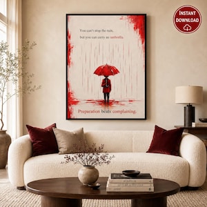 May include: A framed wall art print featuring a person holding a bright red umbrella in the rain. The text reads: You can't stop the rain, but you can carry an umbrella. Preparation beats complaining. The artwork uses red and black ink tones.