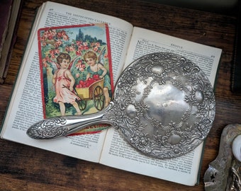 vintage ornate silver vanity handheld mirror