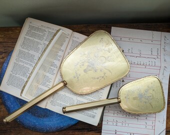 vintage hand held mirror and brush vanity set good with floral bouquet