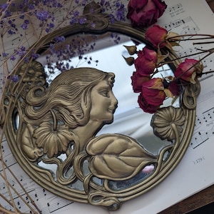 antique art nouveau mirror featuring lady and floral design