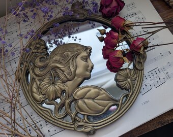 antique art nouveau mirror featuring lady and floral design