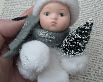 vintage porcelain face snow baby ornament with bottle brush Christmas tree