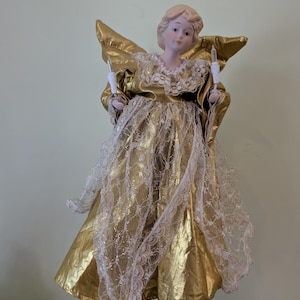 vintage angel Christmas tree topper lights up and moves