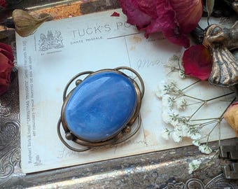 Antique Ruskin blue pottery brooch with an art nouveau setting