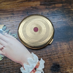 Vintage gold tone Coty powder compact mirror air spun