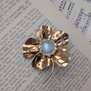 vintage signed Coro floral goldtone brooch with gemstone centre