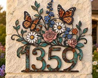 May include: A metal house number sign displaying the digits 1359 in a weathered teal and rust finish. The plaque is decorated with two orange and black monarch butterflies, a pink rose, white daisies, and small blue flowers with green leaves.