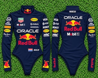 May include: A dark blue long-sleeve bodysuit featuring the Oracle Red Bull Racing team branding, including logos for Tag Heuer, Mobil 1, Honda, and HRC. The front displays the name Max with a Dutch flag, while the back features the Sparco logo.