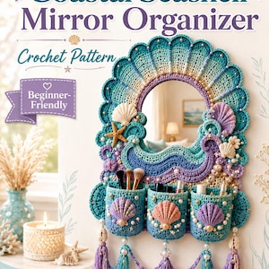 May include: A crochet pattern for a Coastal Seashell Mirror Organizer. The design features a central mirror framed by crocheted waves in blue and purple, adorned with seashells, pearls, and three cylindrical pockets for storage with tassels.