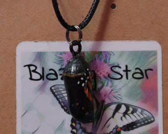 Monarch chrysalis pendant. Looks like its going to hatch.