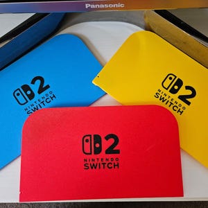 3 coperture a clip stampate in 3D per Nintendo Switch 2 per la base di ricarica