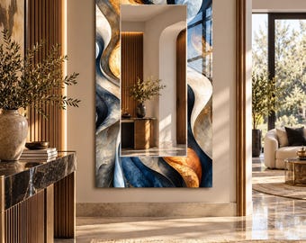 May include: A rectangular wall mirror featuring a decorative frame with fluid, abstract swirls in shades of deep blue, cream, and warm amber. The central reflective glass surface provides a clear view of an interior hallway with wooden accents.