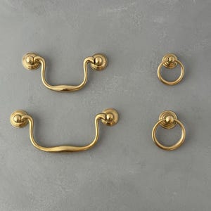 Unlacquered brass bail pulls and ring pulls