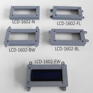 May include: Five gray rectangular frames for LCD-1602 displays. Four frames are empty, labeled LCD-1602-N, LCD-1602-FL, LCD-1602-BW, and LCD-1602-BL. The fifth frame, labeled LCD-1602-FW, contains a dark blue rectangular display screen.