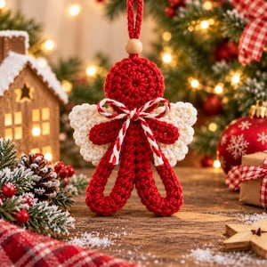 May include: A crocheted gingerbread person ornament in red yarn with white crocheted wings, featuring a small wooden bead at the top loop and a red and white twisted cord bow tied at the neck, designed for hanging on a holiday tree.