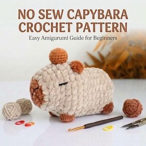 May include: A crochet pattern guide titled NO SEW CAPYBARA CROCHET PATTERN Easy Amigurumi Guide for Beginners featuring a beige and brown plush capybara, two small yarn balls, a brown crochet hook, two stitch markers, and metal scissors.