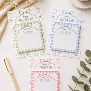 May include: Three rectangular sticky note pads with backing cards, featuring green, blue, and pink gingham patterns. Each pad displays a watercolour bow, the text "happy TEACHER'S DAY," and "a note from" followed by a personalised name.