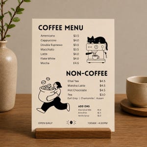 May include: A rectangular cream-coloured menu card featuring black text and illustrations. The menu lists coffee and non-coffee drinks with prices in dollars. Graphics include a cat on an espresso machine and a person carrying a sack of coffee beans.