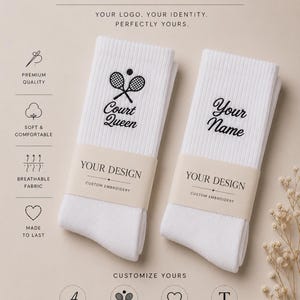 May include: Two white ribbed crew socks featuring custom black embroidery. One sock displays a tennis racket icon with the text Court Queen, and the other displays the text Your Name. Each sock has a paper band labeled YOUR DESIGN.