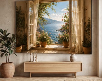 May include: A large rectangular wall art print depicting an open window overlooking a blue sea and mountains. The scene features sheer curtains, terracotta pots with pink flowers, and green foliage. Below the art is a light wood console table.