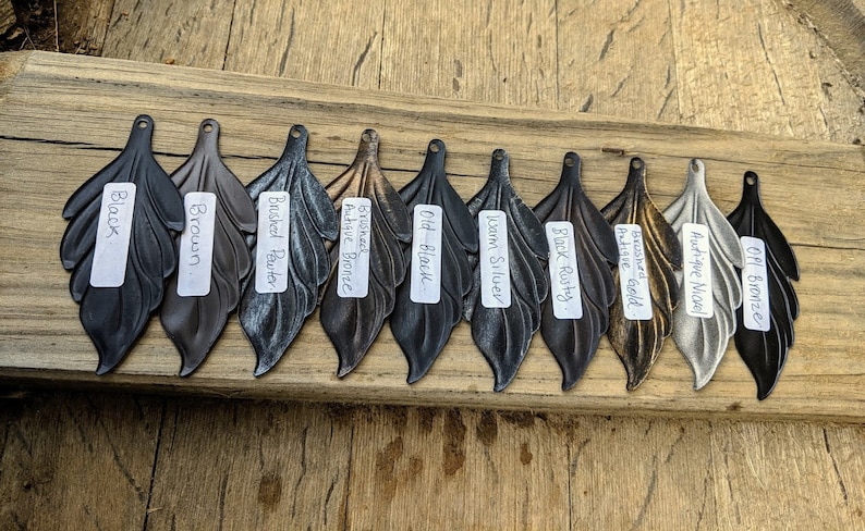 May include: Ten different metal leaf-shaped pulls in various finishes, including black, brown, brushed pewter, antique bronze, old black, warm silver, black rusty, antique gold, antique nickel, and oil bronze.