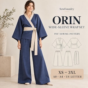 May include: A navy blue wide-sleeve wrap top and matching wide-leg trousers set with a beige sash. The text reads SewFoundry ORIN WIDE-SLEEVE WRAP SET PDF SEWING PATTERN XS-3XL A0 A4 US LETTER, accompanied by technical line drawings of the garment.