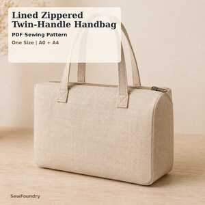 May include: A beige rectangular handbag with two top handles and a top zipper closure. The text on the image reads: Lined Zippered Twin-Handle Handbag, PDF Sewing Pattern, One Size | A0 + A4, and SewFoundry at the bottom corner.
