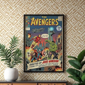 Op de afbeelding: Een ingelijste poster in stripstijl met de titel The Avengers, met Iron Man, Hulk, Thor, Captain America en Black Widow in een stadsgevecht. De tekst bevat Directed by Joss Whedon en Starring Robert Downey Jr, Chris Evans, Mark Ruffalo, Chris Hemsworth, Scarlett Johansson.