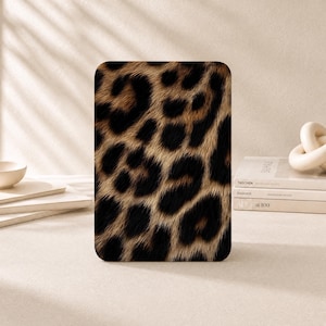 May include: A rectangular tablet case featuring a realistic leopard print pattern with black spots on a tan and brown fur-textured background. The design covers the entire front surface of the case, displaying a repeating animal skin motif.
