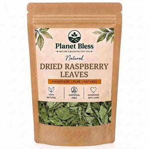 May include: A brown paper pouch containing dried raspberry leaves. The label features the text Planet Bless, Natural DRIED RASPBERRY LEAVES, and icons for 100% natural, chemical free, and handmade with care, with green leaf illustrations.