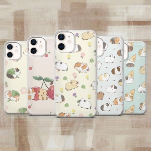 May include: Five smartphone cases featuring various patterns of guinea pigs. The designs include guinea pigs with lettuce, cherries, flowers, and ice cream cones on light-colored backgrounds. Each case has a dual-camera cutout on the back.