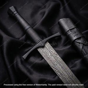 May include: A sword with a patterned Damascus steel blade, a black crossguard, and a ribbed black cylindrical handle. The sword is accompanied by a matching black leather scabbard with textured detailing and cross-laced leather straps.