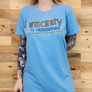 A insanidade dos anos 70 é hereditária, você a herda dos seus filhos, camiseta vintage