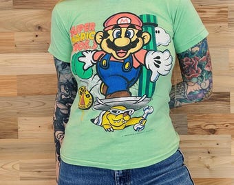 1990 Vintage Super Mario Bros 3 Nintendo Video Game Baby Tee Shirt T-Shirt