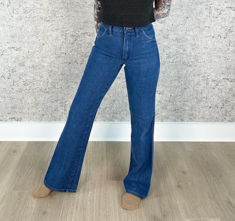 May include: A pair of blue denim flared jeans with a high waist.