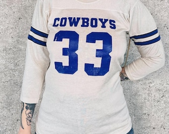 Camiseta vintage de fútbol americano de los Dallas Cowboys de los años 80, número 33, de Tony Dorsett, de la NFL.