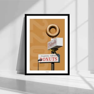 May include: A framed poster featuring a brown background with the number 2200 and the text NORREBRO. It displays a sign for DeAngelis Donuts with a large donut at the top, a white sign reading DeAngelis, and a sign reading Delightfully Different DONUTS.