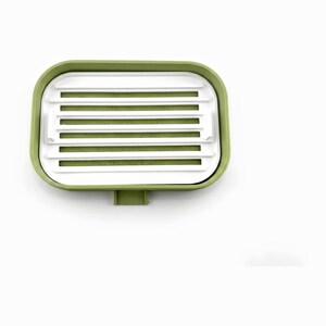 Close top view of the white ripple tray with its drying ribs and drain slots