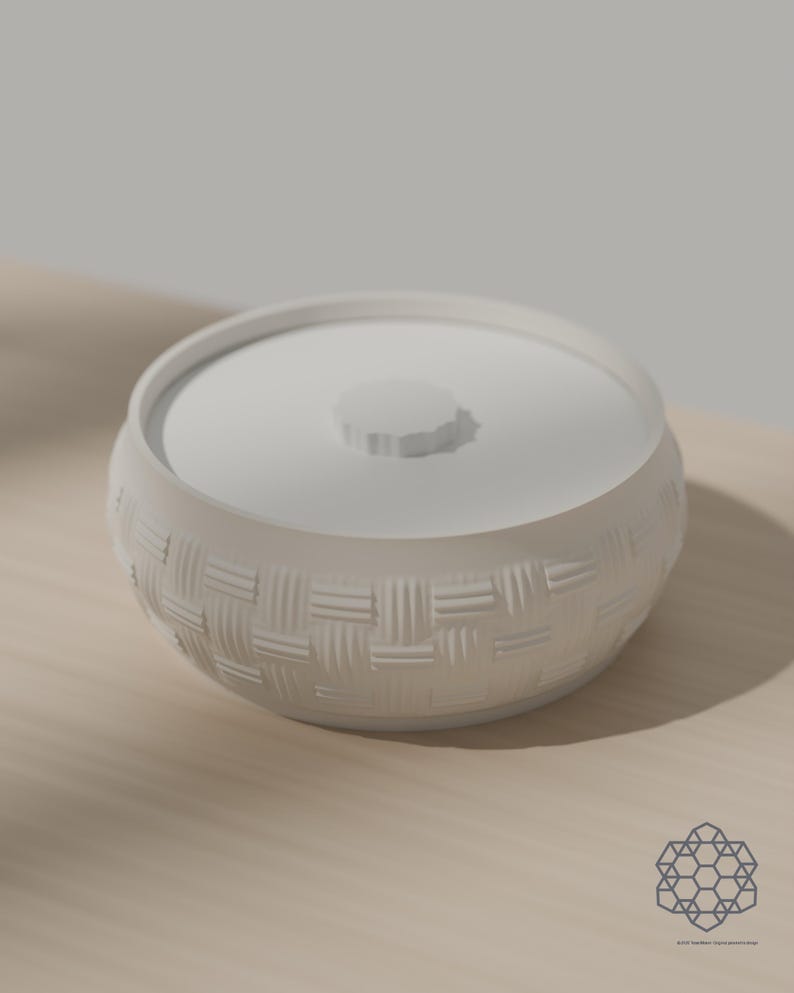 Alabaster white woven storage bowl with white drop-in lid on a sunlit table. 3D-rendered visualization of the exact print file.