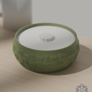 Matcha green woven bowl with lid next to a coffee mug for scale. 3D-rendered visualization of the exact print file.