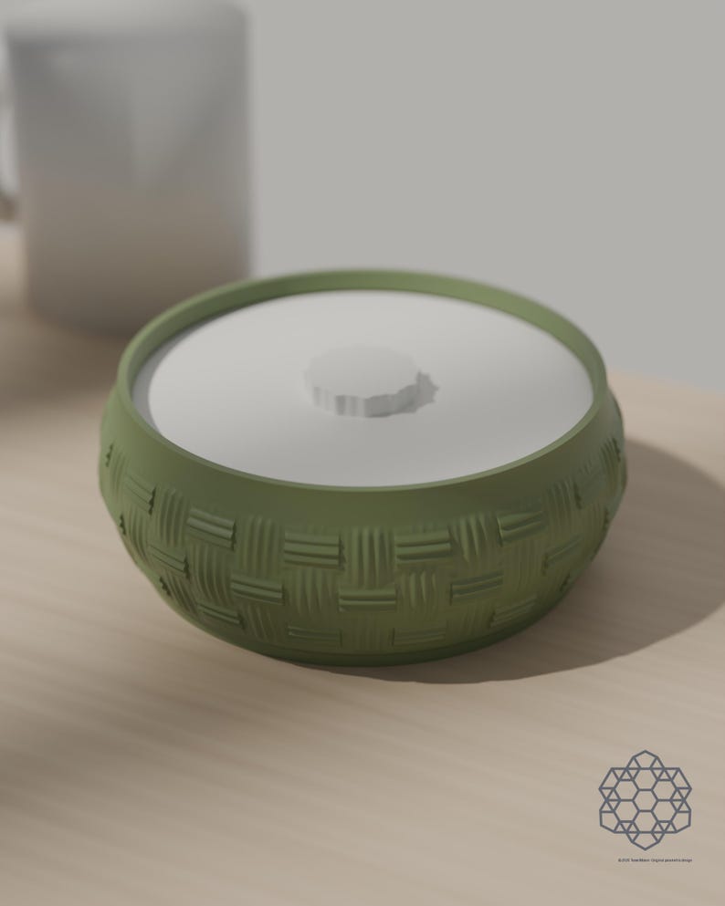 Matcha green woven bowl with lid next to a coffee mug for scale. 3D-rendered visualization of the exact print file.