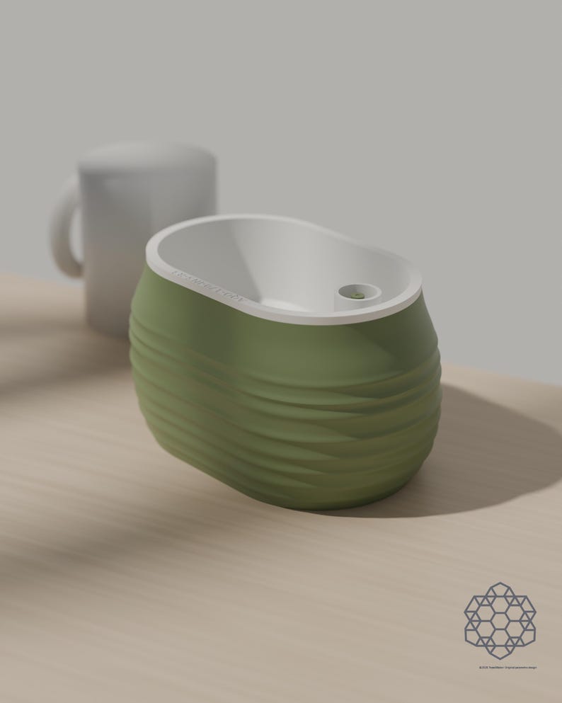 Aquaoval planter in matcha green beside a plain white mug for scale, on a sunlit wooden table. Images include 3D-rendered visualizations of the exact print files.