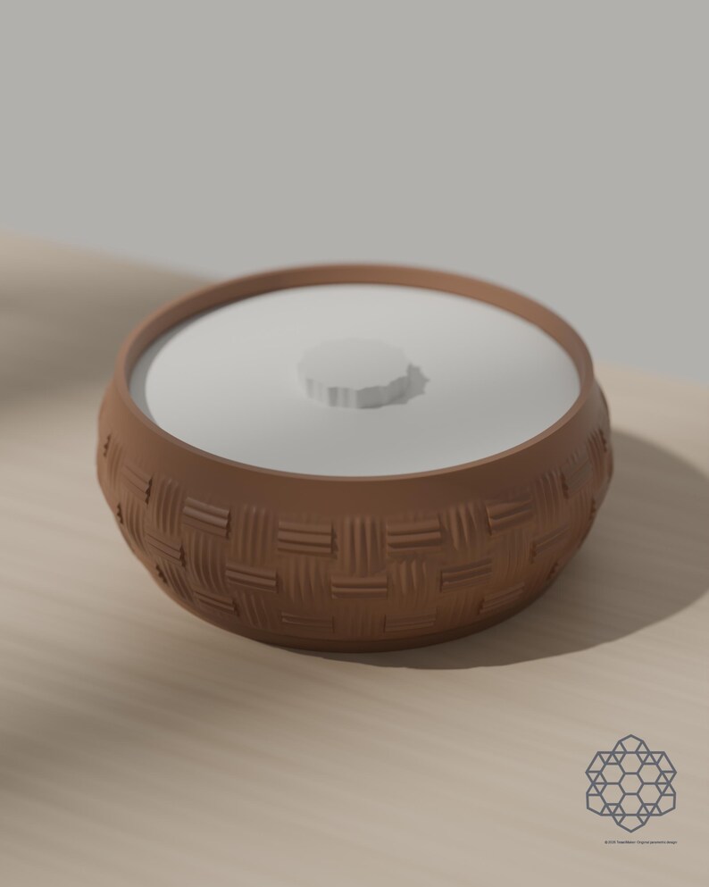 Earth brown woven storage bowl with white drop-in lid on a sunlit table. 3D-rendered visualization of the exact print file.