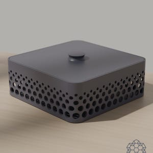 May include: A square dark gray storage box with a lid and a central knob. The sides of the box feature a perforated pattern of circular cutouts that vary in size, creating a gradient effect along the perimeter of the container.