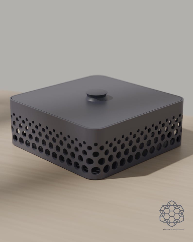 May include: A square dark gray storage box with a lid and a central knob. The sides of the box feature a perforated pattern of circular cutouts that vary in size, creating a gradient effect along the perimeter of the container.