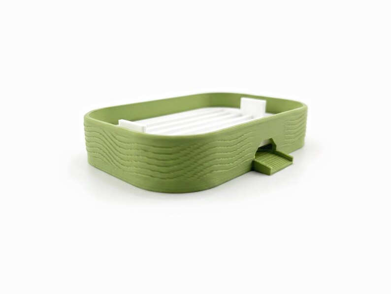 Angled view of the soap dish showing the wavy ribbed texture on its matcha green sides