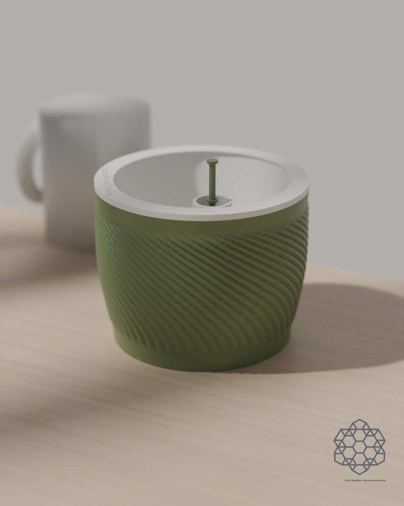 Size comparison: the matcha green Aquapot self watering planter, 127 mm across and 100 mm tall, stands beside a plain white mug on a wooden table. Images include 3D-rendered visualizations of the exact print files.