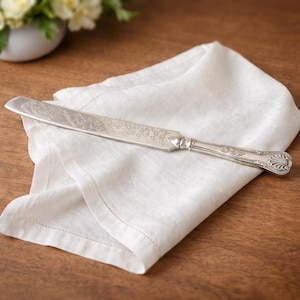 May include: A set of three ceramic mugs with a speckled, matte finish. The mugs are in shades of cream, light gray, and dark gray. Each mug has a simple, minimalist design, perfect for coffee or tea.