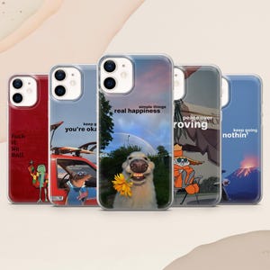 May include: Five clear smartphone cases featuring distinct graphic designs. The designs include a red case with a frog, a car scene with text, a dog holding a yellow flower with text, a cartoon character in a chair, and a volcano scene with text.